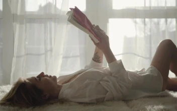 Stock Footage Woman Reading A Story Lying On The Bed Free
