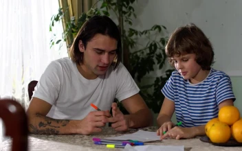 Stock Footage Young Father Teaches His Son To Do His Homework Free