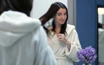 Stock Footage Woman Smiling As She Looks In The Mirror Free