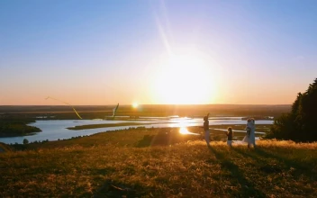 Stock Footage Young Family Flying A Kite In The Sunset Free