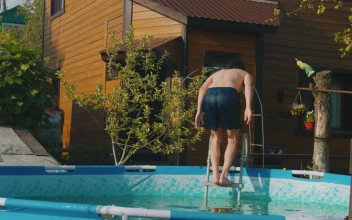Stock Footage Young Man Jumping To An Inflatable Pool Free