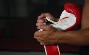 Stock Footage Woman Putting On Boxing Gloves Free