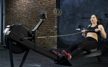 Stock Footage Woman Using A Rowing Machine Free