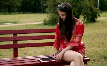 Stock Footage Woman Using Her Tablet In The Park Free
