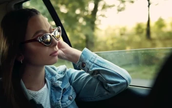 Stock Footage Woman In Denim Jacket Gazes Out Car Window Free
