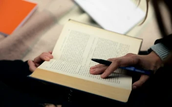 Stock Footage Writer Researching Old Book And Taking Notes Free