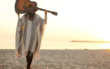 Stock Footage Woman Walks On Sunset Beach With Acoustic Guitar Free