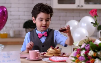 Stock Footage Young Boy Pouring Syrup Over Pancakes Free