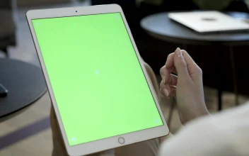 Stock Footage Woman Holding A Tablet With A Green Screen Free