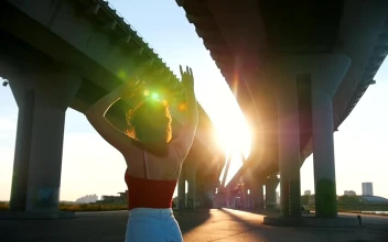 Stock Footage Young Woman Skating Below A Bridge In The Sunlight Free