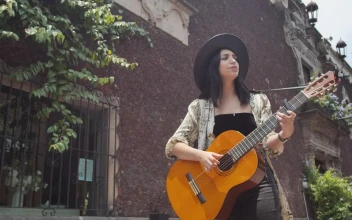 Stock Footage Young Woman Playing Guitar On An Old Street In The Free