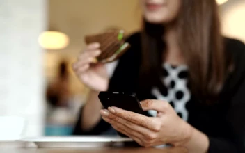 Stock Footage Young Woman Eats Sandwich In Cafe While Texting Free