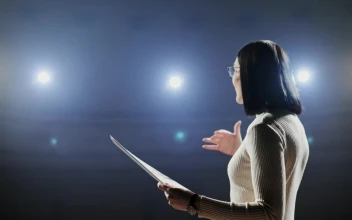 Stock Footage Woman Giving Motivational Talk On Dark Stage With Bright Lights Free