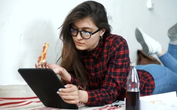 Stock Footage Young Woman Eating Pizza And Relaxing With Tablet Free