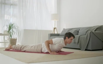 Stock Footage Young Man Doing Yoga Routine At Home In Living Room Free