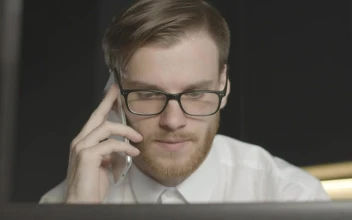 Stock Footage Worried Man On Phone Call Stares At Laptop Free