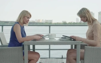 Stock Footage Women Look Over Menu At Bayside Restaurant Free