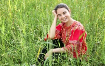 Stock Footage Woman Sitting In A Field Of Long Grass Free