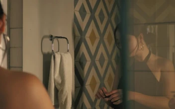 Stock Footage Woman Putting On Lipstick In Front Of A Bathroom Mirror Free