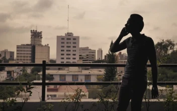 Stock Footage Young Man Having A Call On A Balcony Free