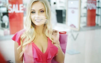 Stock Footage Woman Looks Into Shopping Mall Showcase Free