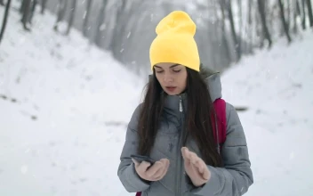 Stock Footage Woman On Winter Hike Uses App On Mobile Phone Free