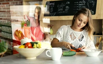 Stock Footage Woman Watches Futuristic Tutorial While Chopping Vegetables Free