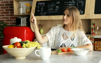 Stock Footage Woman Watches Futuristic Hologram Panel In Kitchen Free