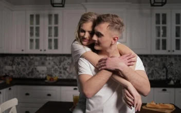 Stock Footage Woman Gives Man Thank You Hug In Kitchen Free