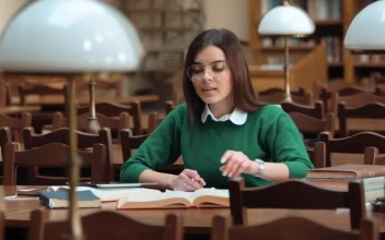 Stock Footage Woman Focused On Research In Library With Books Free