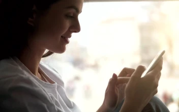 Stock Footage Woman Smiles While Using Mobile App Free