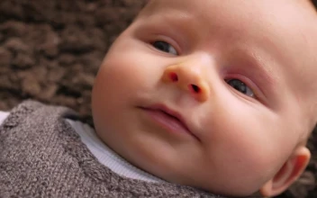Stock Footage Young Baby Laying On The Floor Free