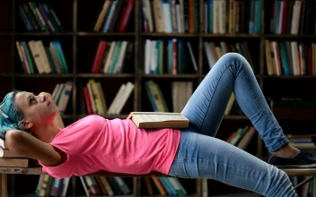 Stock Footage Woman Laying Down With Her Books Free