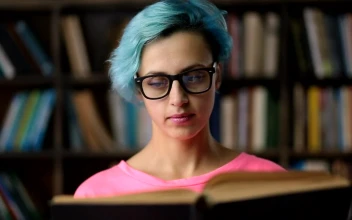 Stock Footage Woman With Glasses Reading A Book Free