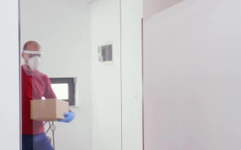 Stock Footage Woman Uses Mobile Pay For Delivery During Pandemic Free