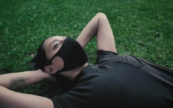 Stock Footage Young Woman Doing Sit Ups With A Face Mask Free
