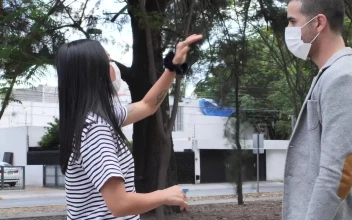 Stock Footage Woman Giving Directions To A Man With A Face Mask Free