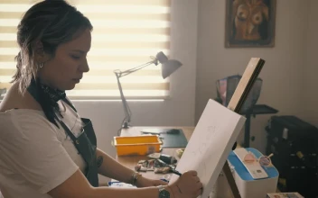 Stock Footage Woman Drawing On A Painting In Her Home Studio Free