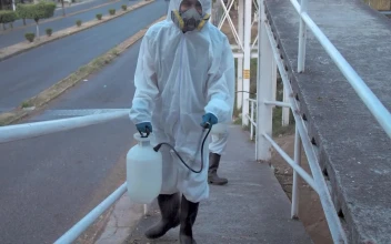 Stock Footage Workers In Hazmat Suits On A Pedestrian Bridge Free
