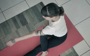 Stock Footage Young Woman Doing Yoga On A Red Mat Free