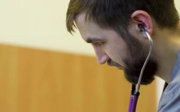 Stock Footage Young Doctor Listening Through His Stethoscope Free
