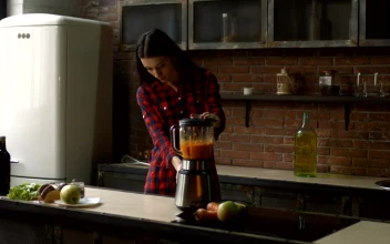 Stock Footage Young Woman Preparing A Smoothie In A Kitchen Free