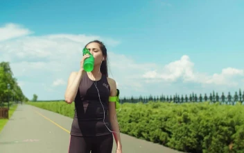 Stock Footage Woman In Activewear Drinking Water After Running Free