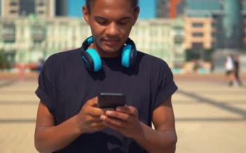 Stock Footage Young Man On The Street Typing On His Cell Phone Free
