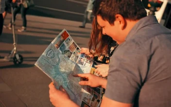 Stock Footage Young Tourists Locating Themselves On A Map Free