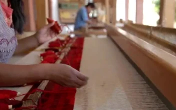Stock Footage Woman Weaving A Cloth On A Large Wooden Loom Free
