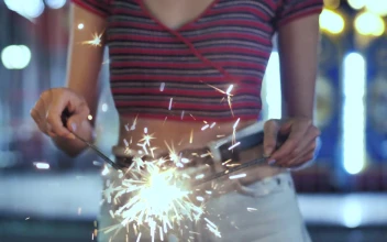 Stock Footage Woman Holding A Sparklers At The Fair Free