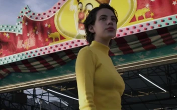 Stock Footage Woman Walking In Front Of Mechanical Rides Free