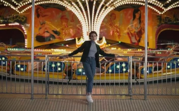 Stock Footage Woman Standing In Front Of Amusement Park Ride Free