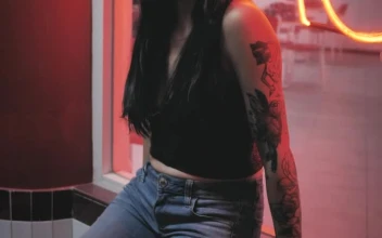 Stock Footage Woman With Tattoos In A Shop Window Free